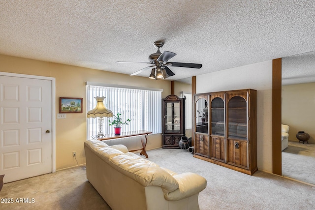 7210 W Caron Dr, Peoria, AZ 85345 - living room with carpet flooring, ceiling fan, and a textured ceiling