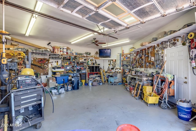 7210 W Caron Dr, Peoria, AZ 85345 - garage with a workshop area and ceiling fan