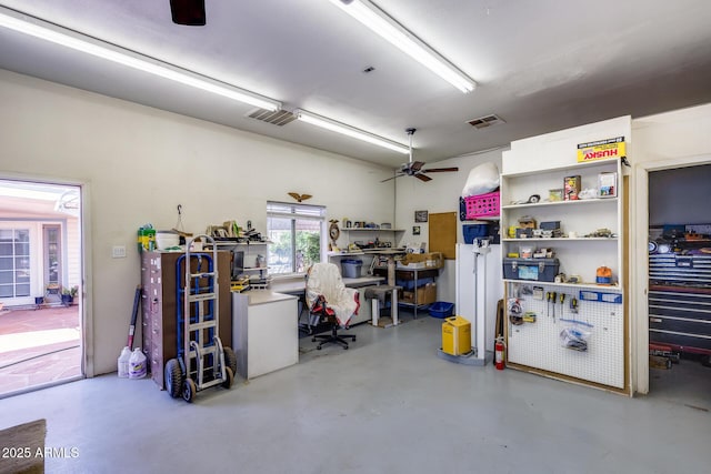 7210 W Caron Dr, Peoria, AZ 85345 - garage featuring a workshop area and ceiling fan