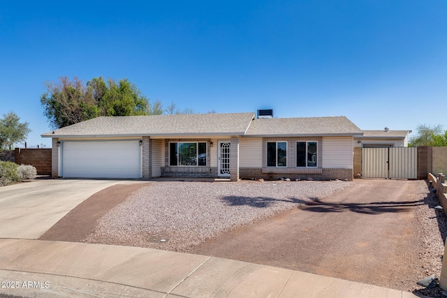 7210 W Caron Dr, Peoria, AZ 85345 - ranch-style house featuring driveway, a garage, a gate, and brick siding