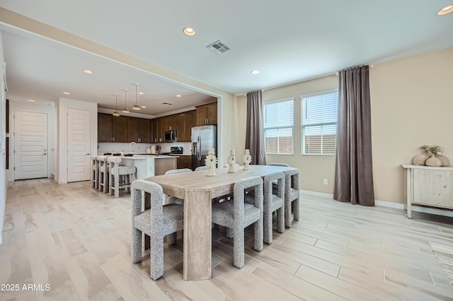 10105 E Ulysses Ave, Mesa, AZ 85212 - dining area featuring recessed lighting, light wood-type flooring, and baseboards