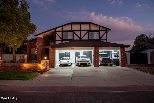 tudor home featuring a garage