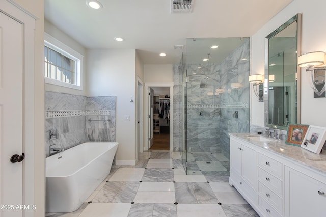 bathroom with independent shower and bath and vanity