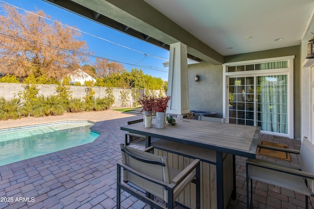 view of patio / terrace featuring a fenced in pool