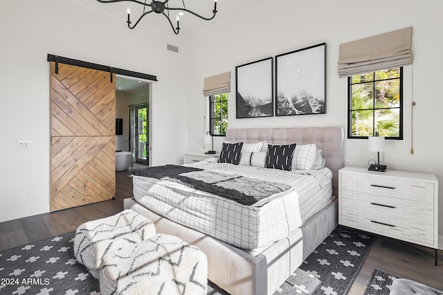 5929 E Indian School Rd, Phoenix, AZ 85018 - bedroom with dark wood-style floors, a chandelier, crown molding, and a barn door