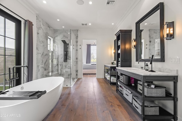 5929 E Indian School Rd, Phoenix, AZ 85018 - bathroom featuring a marble finish shower, a soaking tub, crown molding, hardwood / wood-style floors, and recessed lighting