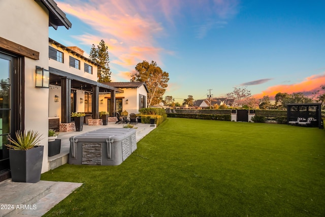 5929 E Indian School Rd, Phoenix, AZ 85018 - yard at dusk featuring a lawn and a patio