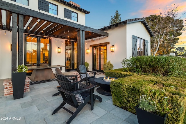 5929 E Indian School Rd, Phoenix, AZ 85018 - view of patio with an outdoor fire pit and french doors