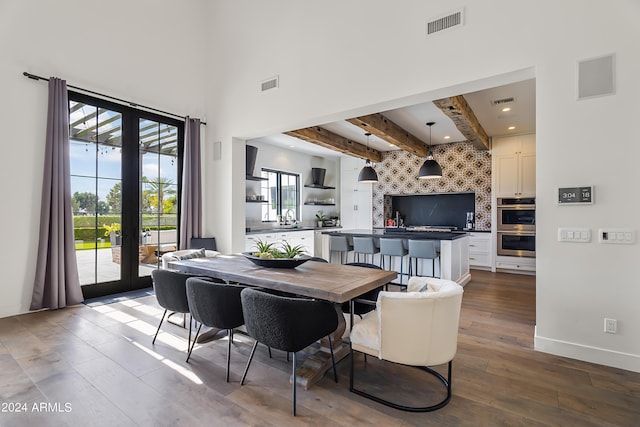 5929 E Indian School Rd, Phoenix, AZ 85018 - dining space featuring beamed ceiling, wood-type flooring, french doors, recessed lighting, and baseboards