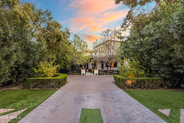 5929 E Indian School Rd, Phoenix, AZ 85018 - view of front of house featuring a yard, a gate, and decorative driveway