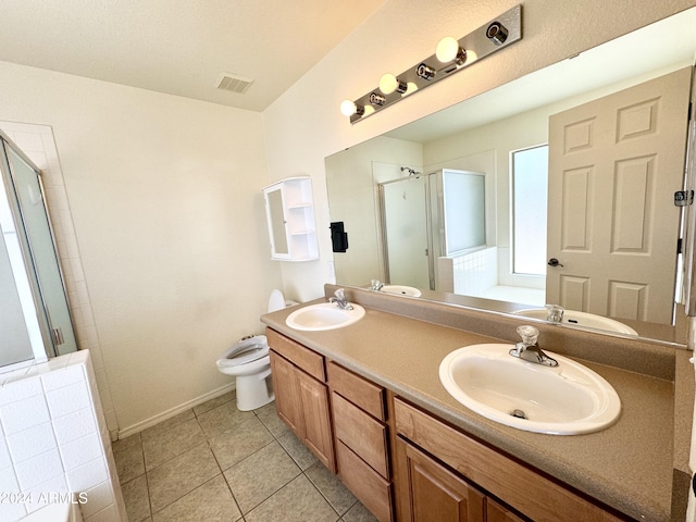 full bath featuring a sink, visible vents, and a shower stall