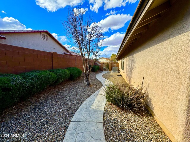 view of yard with cooling unit and a fenced backyard