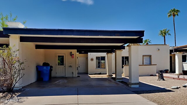 view of front of home with a carport