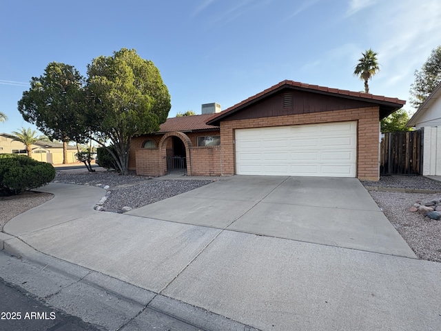 2264 S Don Carlos, Mesa, AZ 85202 - ranch-style house featuring a garage, brick siding, concrete driveway, and a chimney