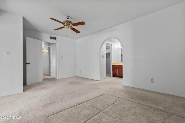 2264 S Don Carlos, Mesa, AZ 85202 - unfurnished room featuring ceiling fan, light carpet, and arched walkways