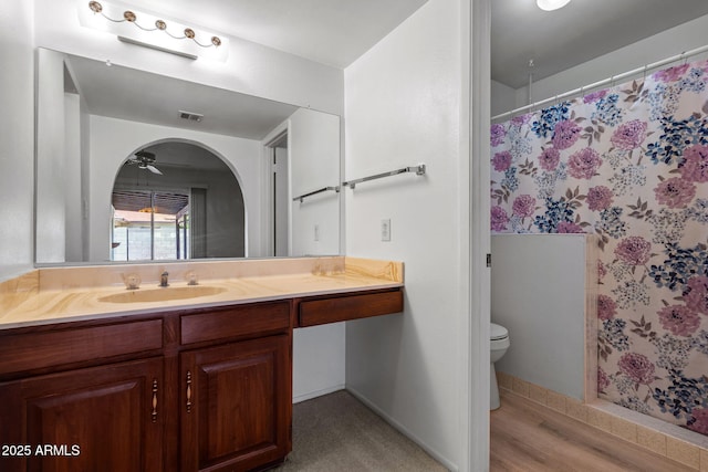 2264 S Don Carlos, Mesa, AZ 85202 - bathroom with toilet, vanity, curtained shower, and baseboards