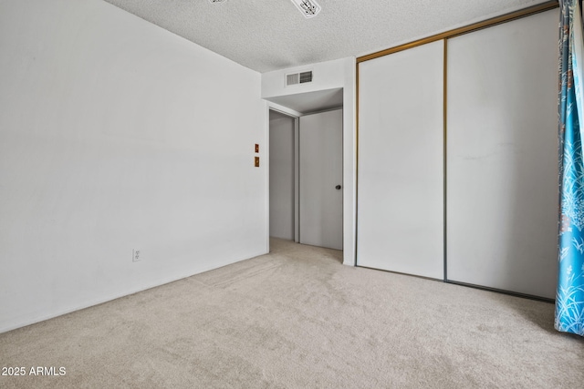 2264 S Don Carlos, Mesa, AZ 85202 - unfurnished bedroom with carpet floors, a textured ceiling, and a closet