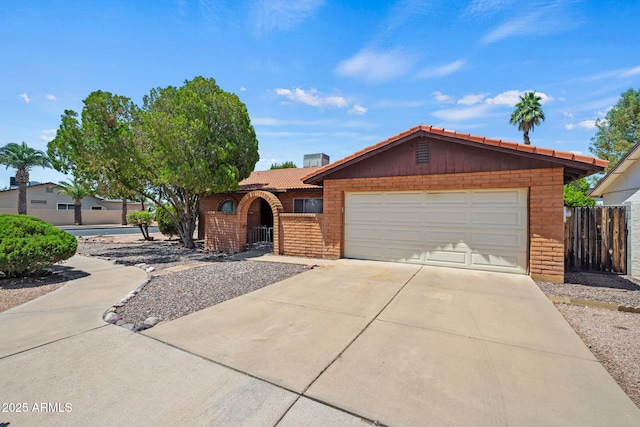2264 S Don Carlos, Mesa, AZ 85202 - single story home with concrete driveway, brick siding, an attached garage, and a tiled roof