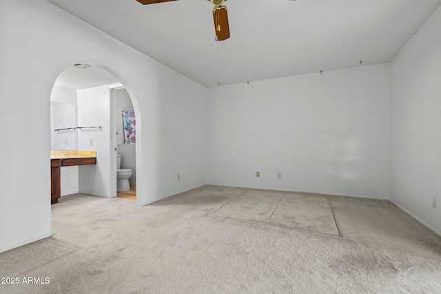 2264 S Don Carlos, Mesa, AZ 85202 - unfurnished room featuring light carpet, arched walkways, a ceiling fan, and baseboards