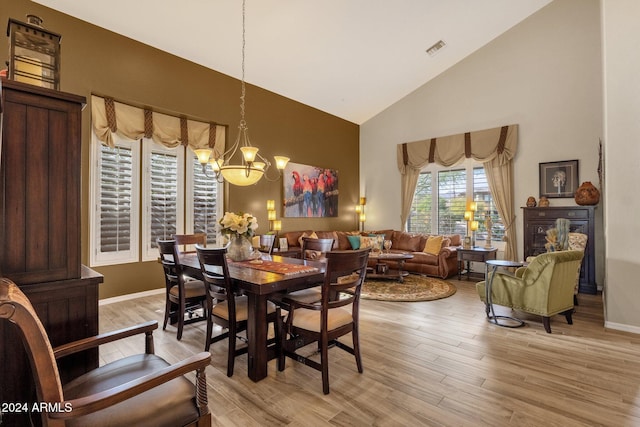 15439 E Acacia Way, Fountain Hills, AZ 85268 - dining area with an inviting chandelier, light wood-type flooring, visible vents, and high vaulted ceiling