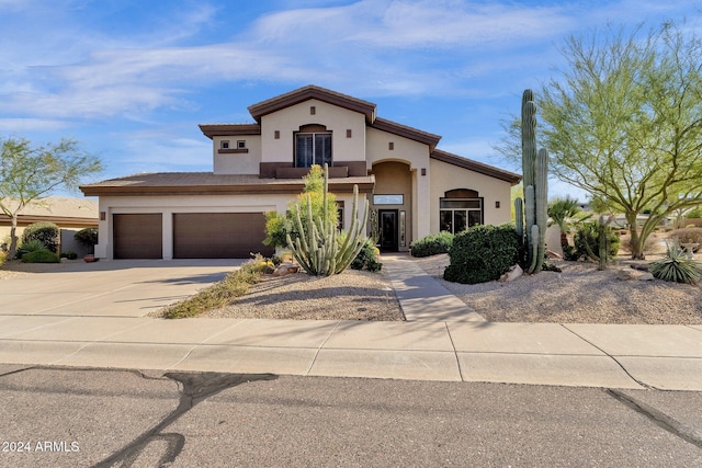 15439 E Acacia Way, Fountain Hills, AZ 85268 - mediterranean / spanish-style home featuring concrete driveway and stucco siding