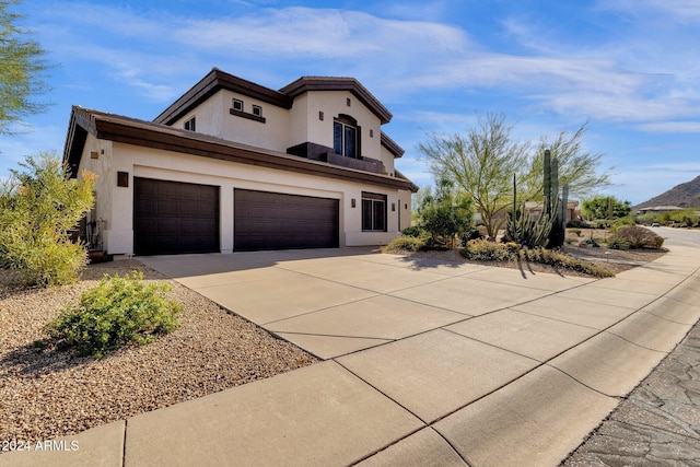 15439 E Acacia Way, Fountain Hills, AZ 85268 - mediterranean / spanish house with driveway, stucco siding, and a garage