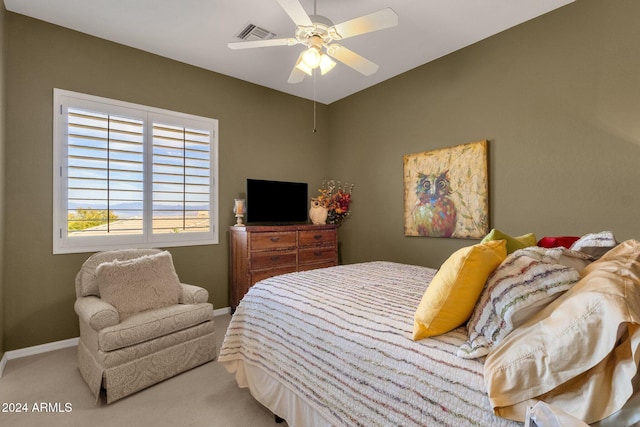 bedroom featuring ceiling fan and light colored carpet