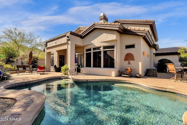15439 E Acacia Way, Fountain Hills, AZ 85268 - back of property featuring a patio, stucco siding, a chimney, and a fenced in pool