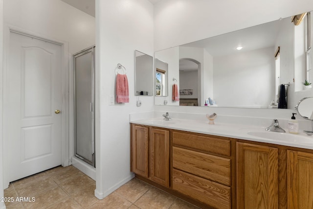 bathroom with vanity, tile patterned floors, and walk in shower