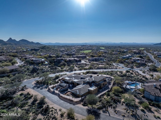 birds eye view of property with a mountain view