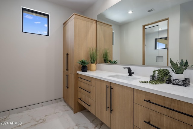 bathroom featuring vanity and a wealth of natural light