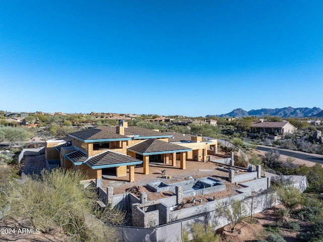 birds eye view of property with a mountain view