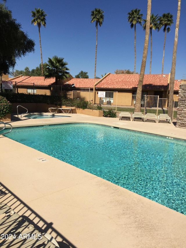 view of swimming pool featuring a patio area