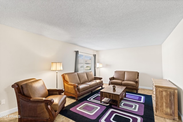 living room with light carpet and a textured ceiling