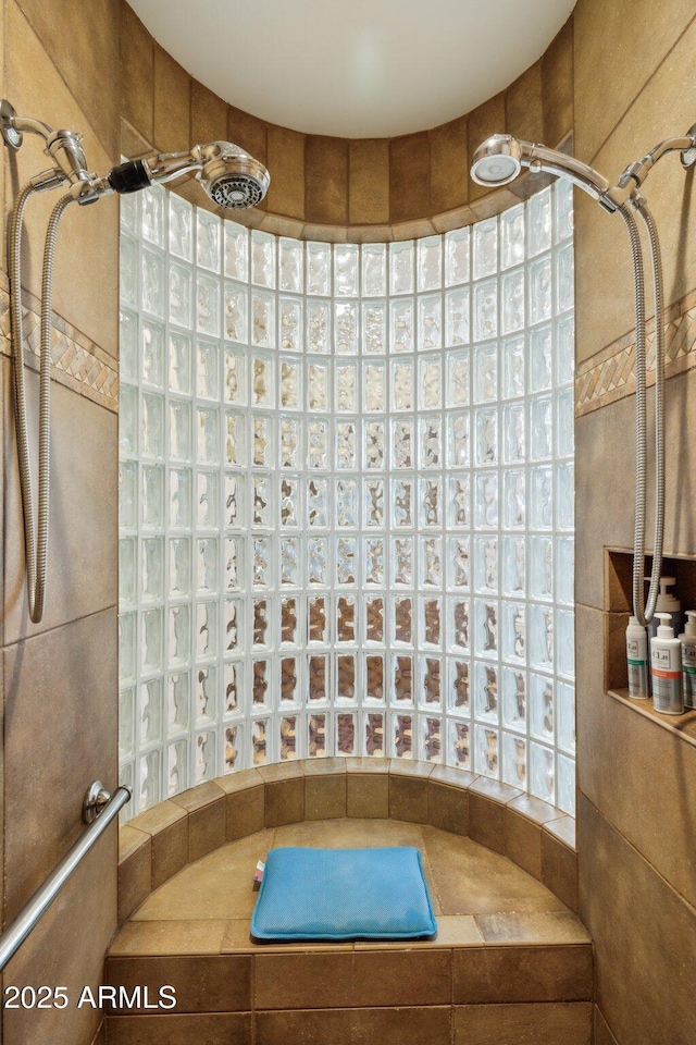 bathroom featuring tiled shower