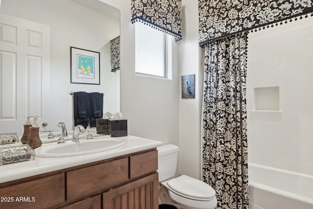 full bathroom featuring vanity, shower / bath combination with curtain, and toilet