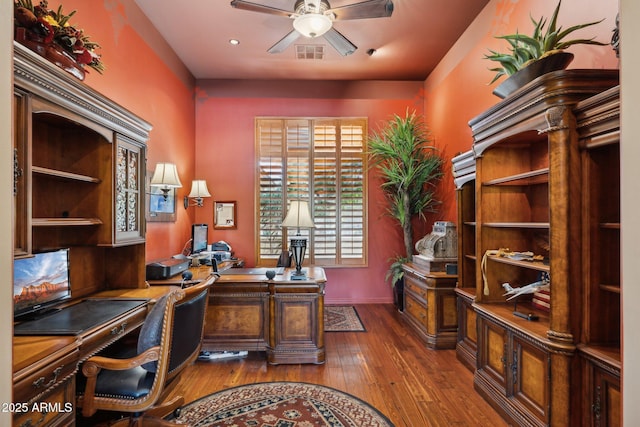 office area featuring dark wood-type flooring and ceiling fan