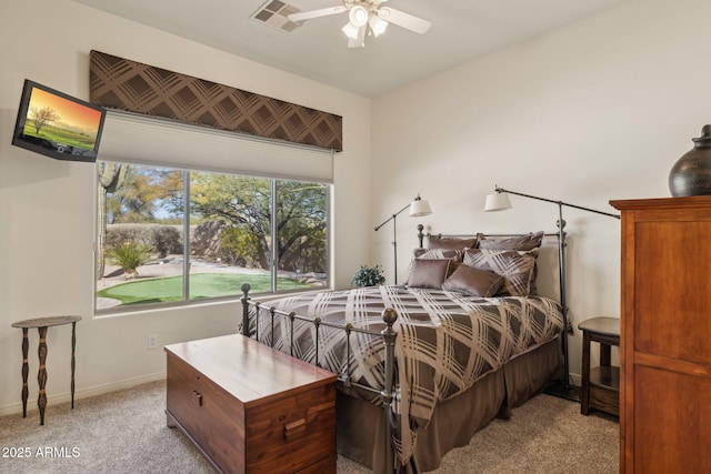 bedroom featuring light carpet and ceiling fan