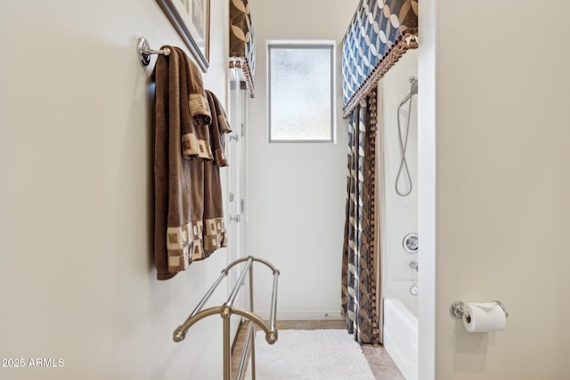 bathroom featuring shower / bath combination with curtain