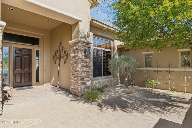 property entrance with a patio