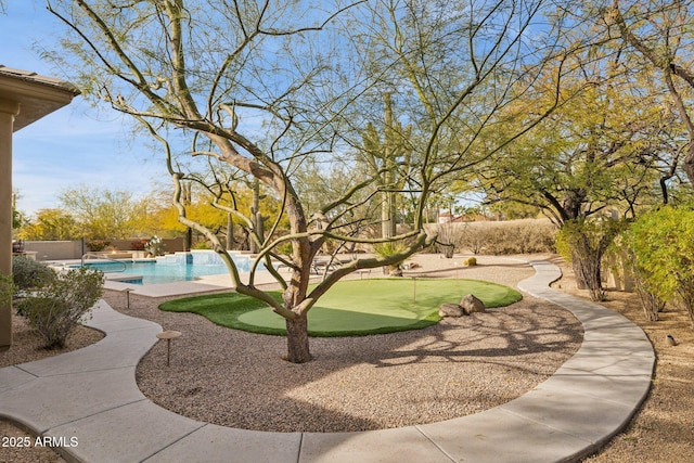 exterior space featuring a fenced in pool