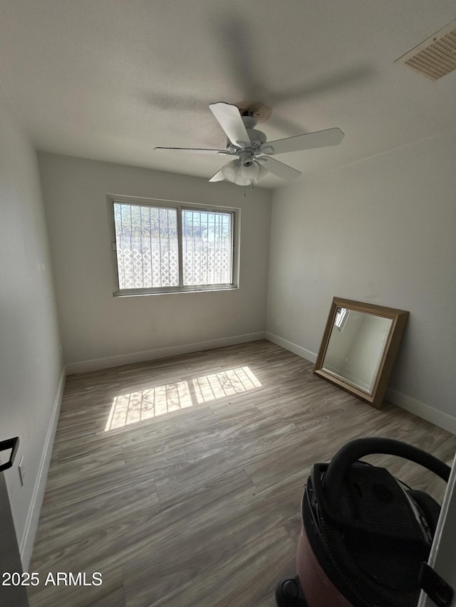 937 W Cocopah St, Phoenix, AZ 85007 - empty room with a ceiling fan, wood finished floors, and baseboards