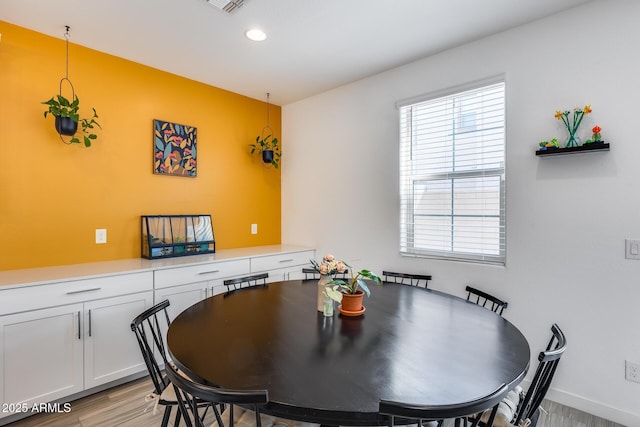 dining area featuring light wood-type flooring, visible vents, and recessed lighting