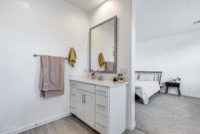 bathroom featuring vanity and baseboards