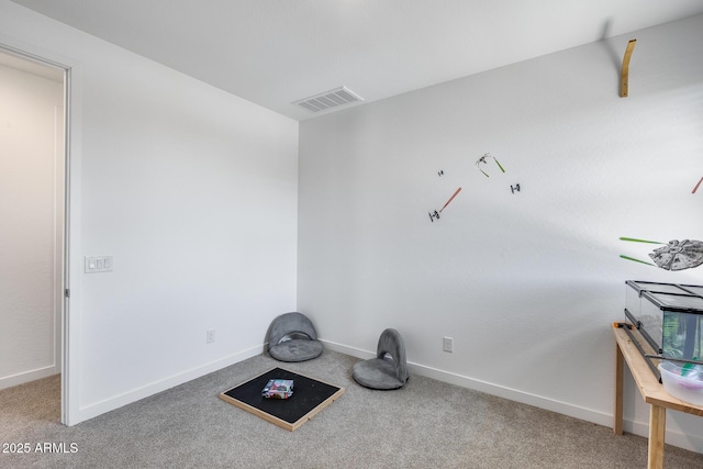 interior space featuring baseboards, carpet, and visible vents