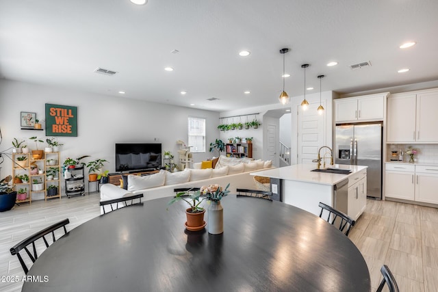 dining area with visible vents and recessed lighting