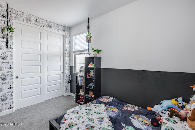 carpeted bedroom with a closet