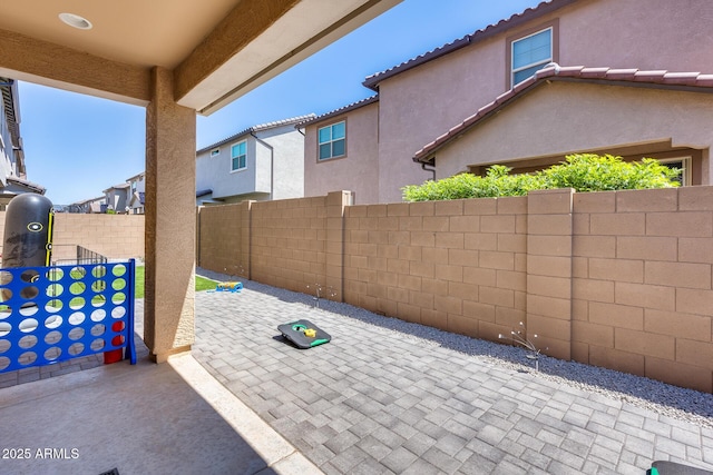 view of patio / terrace featuring fence