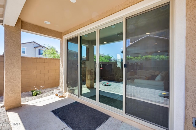exterior space featuring a patio, stucco siding, and fence