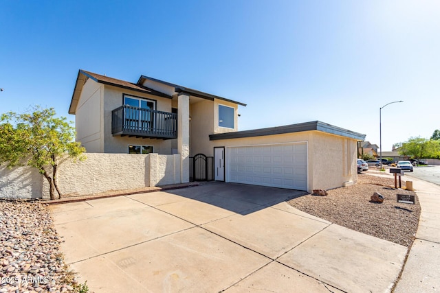 1521 W Jacinto Ave, Mesa, AZ 85202 - view of front facade with driveway, a balcony, stucco siding, an attached garage, and a gate
